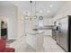 Bright kitchen featuring white cabinetry, granite countertops, and stainless appliances at 514 Vallecrosia Ct., Little River, SC 29566