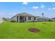 Spacious backyard featuring lush green grass and a charming home with a screened porch at 515 Goldstar St., Conway, SC 29526