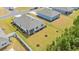 Aerial view of a backyard with a screened patio, green lawn, and mulched tree plantings at 515 Goldstar St., Conway, SC 29526