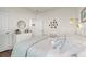 Cozy bedroom featuring a beautifully decorated queen size bed, wooden floor, and natural light from the window at 515 Goldstar St., Conway, SC 29526