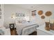 Cozy bedroom featuring a beautifully decorated queen size bed, wooden floor, and natural light from the window at 515 Goldstar St., Conway, SC 29526
