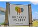 Buckeye Forest community sign with tree graphics and established in 2022 at 515 Goldstar St., Conway, SC 29526