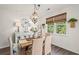 Stylish dining area featuring a rustic table, woven chairs, and a decorative chandelier at 515 Goldstar St., Conway, SC 29526