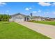 A view of a home exterior with green lawn and long driveway at 515 Goldstar St., Conway, SC 29526