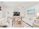 Bright living room with white sofas, accent pillows, stylish decor, and a media center at 515 Goldstar St., Conway, SC 29526