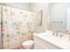 Bright bathroom with a tropical themed shower curtain at 5223 Sea Coral Way, North Myrtle Beach, SC 29582