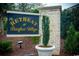 Welcoming 'The Retreat at Barefoot Village' sign with manicured landscaping at the community entrance at 5223 Sea Coral Way, North Myrtle Beach, SC 29582