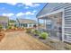 Backyard with a screened porch, lush landscaping, and serene outdoor space at 6037 Campanella St., Myrtle Beach, SC 29577