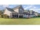 This beautiful backyard view features a well-manicured lawn, screened in porch, and privacy fence at 611 Indigo Bunting Ln. # 42 E, Murrells Inlet, SC 29576