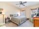 Cozy bedroom featuring a ceiling fan, neutral color scheme, and natural light from two windows at 611 Indigo Bunting Ln. # 42 E, Murrells Inlet, SC 29576