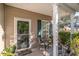 Inviting front porch with seating area, perfect for relaxing and enjoying the outdoors at 611 Indigo Bunting Ln. # 42 E, Murrells Inlet, SC 29576