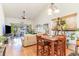 Combined living and dining area with hardwood floors, vaulted ceiling, and sliding glass doors to patio at 611 Indigo Bunting Ln. # 42 E, Murrells Inlet, SC 29576