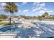Resort-style community pool and hot tub area with ample seating and lush landscaping on a sunny day at 611 Indigo Bunting Ln. # 42 E, Murrells Inlet, SC 29576