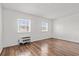 Bedroom with hardwood floors and two windows letting in natural light at 6850 Blue Heron Blvd. # 205, Myrtle Beach, SC 29588