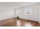 Bright bedroom with hardwood floors and two windows letting in natural light at 6850 Blue Heron Blvd. # 205, Myrtle Beach, SC 29588