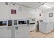 On-site laundry room with modern machines for residents, providing convenience and ease at 6850 Blue Heron Blvd. # 205, Myrtle Beach, SC 29588