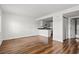 Bright living room with hardwood floors, with an open view to the kitchen at 6850 Blue Heron Blvd. # 205, Myrtle Beach, SC 29588