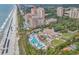 An aerial view of an oceanfront resort featuring multiple pools, beach access, and luxurious accommodations at 7205 Spoleto Dr., Myrtle Beach, SC 29572