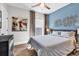 A cozy bedroom featuring a queen-sized bed, ceiling fan, and natural light from the window at 7205 Spoleto Dr., Myrtle Beach, SC 29572