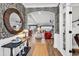 Inviting foyer boasts decorative wallpaper, a stylish mirror, and hardwood flooring leading to the living spaces at 7205 Spoleto Dr., Myrtle Beach, SC 29572