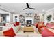 Cozy living room showcasing a fireplace, ceiling fan, neutral paint colors, and comfortable seating arrangement at 7205 Spoleto Dr., Myrtle Beach, SC 29572