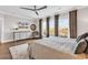 Spacious bedroom featuring a ceiling fan, water view, and a television for relaxing entertainment at 7205 Spoleto Dr., Myrtle Beach, SC 29572