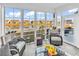 Inviting sunroom with comfortable seating and panoramic views of the lake and surrounding neighborhood at 7205 Spoleto Dr., Myrtle Beach, SC 29572