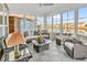 Bright sunroom with large windows, comfortable seating, and scenic water views, perfect for relaxing at 7205 Spoleto Dr., Myrtle Beach, SC 29572