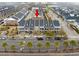 An aerial view of the neighborhood with multiple multi-Gathering houses, a street view with trees, and a clear sky at 730 Farrow Pkwy. # D, Myrtle Beach, SC 29577