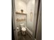 Cozy half bathroom with floating shelves and charming decorative accents at 730 Farrow Pkwy. # D, Myrtle Beach, SC 29577