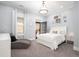 Bright bedroom with a cozy chaise lounge, natural light, and elegant decor at 730 Farrow Pkwy. # D, Myrtle Beach, SC 29577
