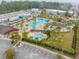 Aerial view showcases a large community pool with multiple sections, seating, and landscaping at 730 Farrow Pkwy. # D, Myrtle Beach, SC 29577