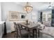 An open-concept dining area flows seamlessly into the living space with a decorative light fixture and ample natural light at 730 Farrow Pkwy. # D, Myrtle Beach, SC 29577