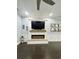 A modern electric fireplace with a wooden mantel and sleek design enhances this inviting living space at 730 Farrow Pkwy. # D, Myrtle Beach, SC 29577