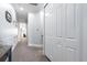 A well-lit hallway with a storage closet offers seamless transitions between living spaces at 730 Farrow Pkwy. # D, Myrtle Beach, SC 29577