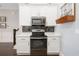 A well-lit kitchen boasts stainless steel appliances, sleek dark backsplash, and ample counter space for cooking at 730 Farrow Pkwy. # D, Myrtle Beach, SC 29577