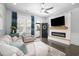 Comfortable living room featuring a modern fireplace, a large television, and stylish decor at 730 Farrow Pkwy. # D, Myrtle Beach, SC 29577