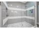 Elegant shower with mosaic tile accents and a frameless glass enclosure at 730 Farrow Pkwy. # D, Myrtle Beach, SC 29577