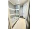 Modern tiled shower with glass door, pebble floor, and built-in shelving at 730 Farrow Pkwy. # D, Myrtle Beach, SC 29577