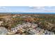 Beautiful aerial view of homes nestled around a serene pond with ocean views in the distance at 765 Pinehurst Ln. # 96-C, Pawleys Island, SC 29585