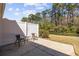 Outdoor patio surrounded by green trees and lush landscape creating a peaceful outdoor space at 765 Pinehurst Ln. # 96-C, Pawleys Island, SC 29585