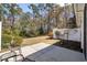 Serene backyard with seating area and mature trees, perfect for outdoor relaxation and entertainment at 765 Pinehurst Ln. # 96-C, Pawleys Island, SC 29585