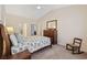 Comfortable bedroom with neutral walls, vaulted ceiling, and a traditional wood dresser at 765 Pinehurst Ln. # 96-C, Pawleys Island, SC 29585