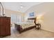 Inviting bedroom featuring neutral walls, shuttered windows, and a cozy floral patterned bedding at 765 Pinehurst Ln. # 96-C, Pawleys Island, SC 29585