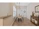 Charming dining nook with a round table, stylish decor, and natural light, offering a welcoming space for meals at 765 Pinehurst Ln. # 96-C, Pawleys Island, SC 29585