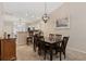 Elegant dining room adjacent to the kitchen, featuring a large table, stylish chairs, and a view of modern decor at 765 Pinehurst Ln. # 96-C, Pawleys Island, SC 29585