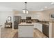 Bright kitchen with stainless steel appliances, granite countertops and a center island at 765 Pinehurst Ln. # 96-C, Pawleys Island, SC 29585