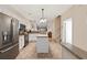 Open kitchen with white cabinets, granite countertops and stainless steel refrigerator at 765 Pinehurst Ln. # 96-C, Pawleys Island, SC 29585