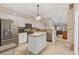 Well-lit kitchen with stainless steel appliances and a breakfast bar overlooking the living room at 765 Pinehurst Ln. # 96-C, Pawleys Island, SC 29585