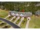 Stunning aerial view of townhomes with manicured lawns and tree-lined streets, showcasing community charm at 822 Foxtail Dr. # 822, Longs, SC 29568